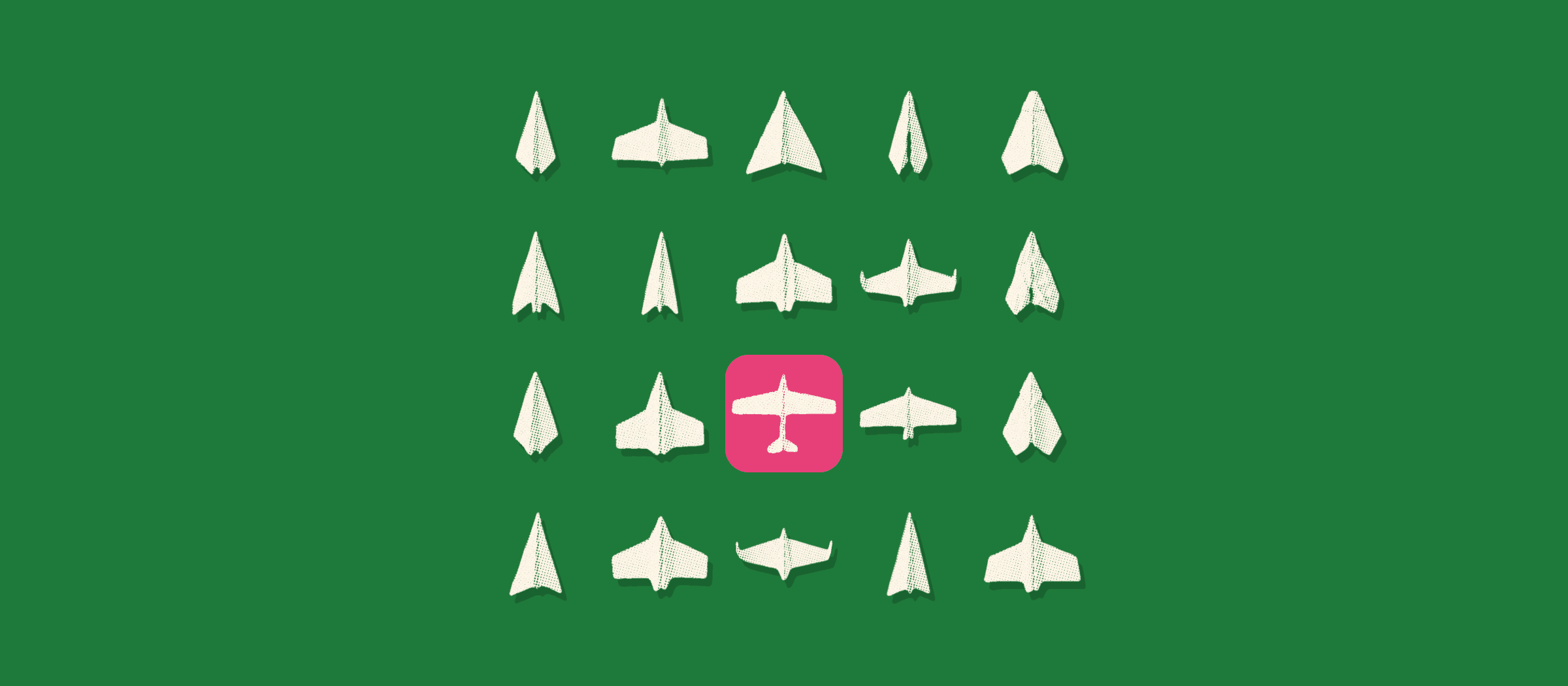 A field of paper planes on green, one picked on a hot pink tile.